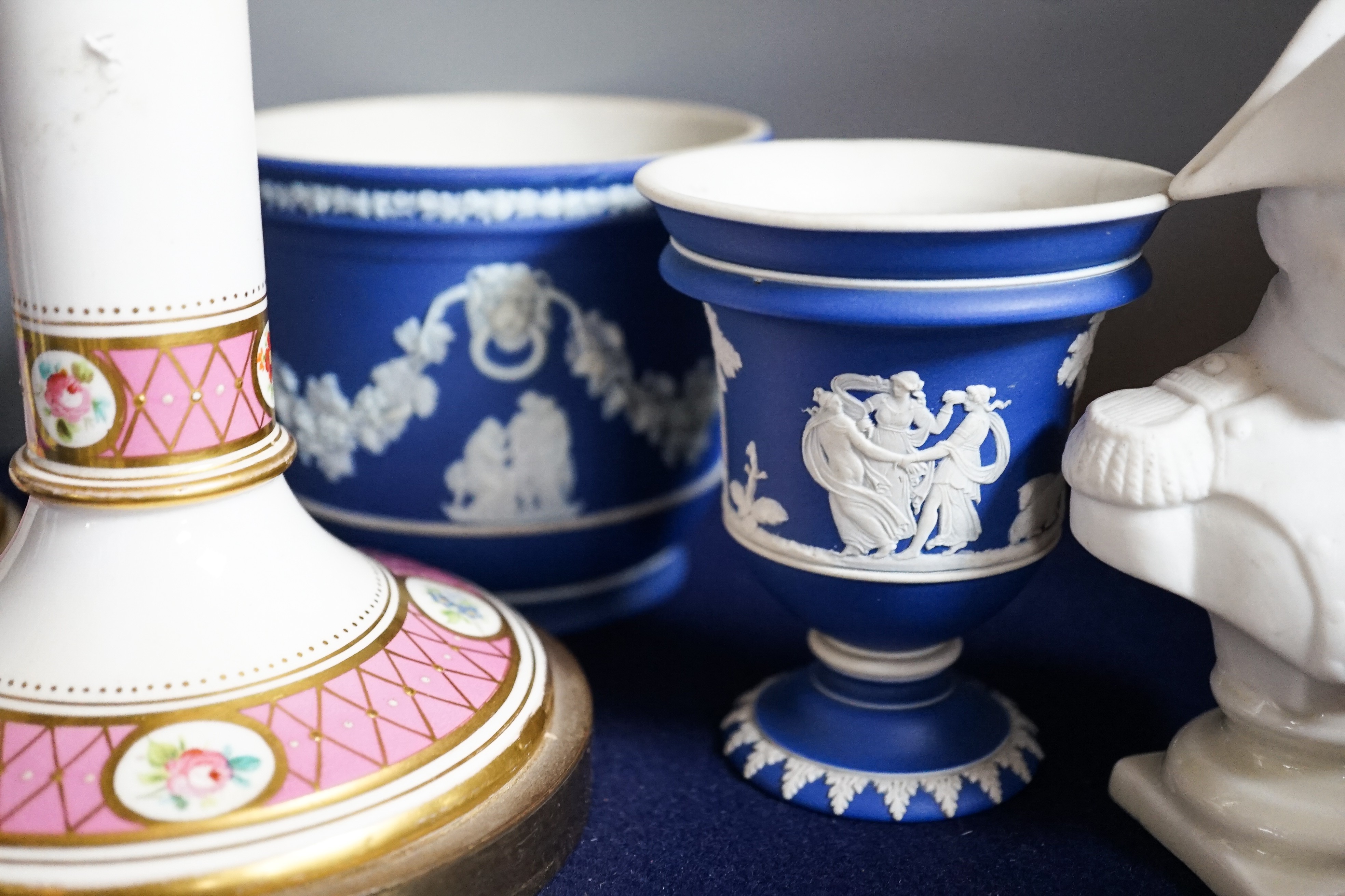 Three mid to late 19th century pieces of Wedgwood Jasperware, including a coffee pot and a small cashe-pot, a pair of 19th century porcelain candlesticks converted into lamps